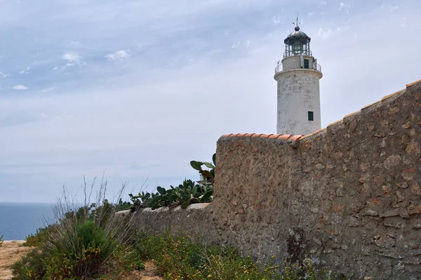La Mola lighthouse in the Formentera Island. This lighthouse is famous because, according to the legend, it inspired Julio Verne for its novels Hector Serdavac and The lighthouse of the end of the world. Balearic Islands. Spain