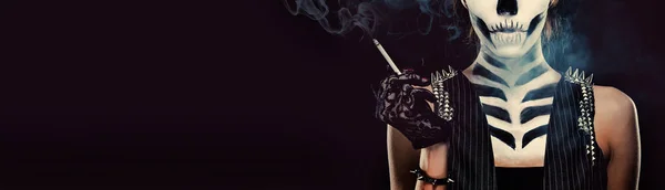 Woman with skeleton face art smoking panorama