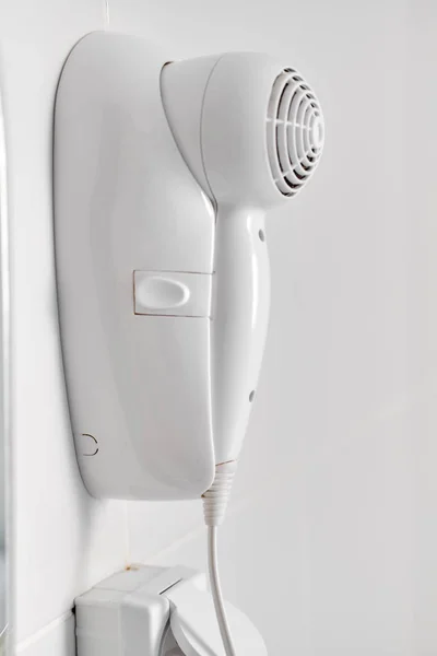Hair dryer  over white wall — Stock Photo, Image