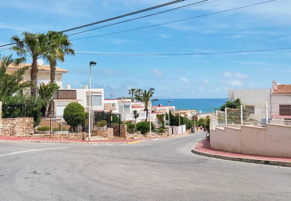 Roadside view to the empty road leading to Mediterranean Sea — Stock Photo, Image