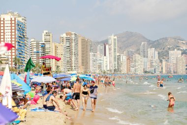 Lot of vacationers on the beach of Benidorm, Costa Blanca, Spain clipart