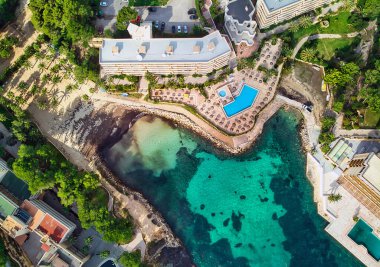 Drone point of view Cala Vinyes, green transparent water bay of Mediterranean Sea. Majorca, Espana, Spain clipart