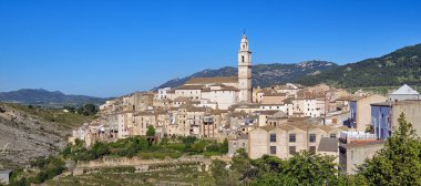 Day time view to the Bocairent village against rocky mountains. Comarca of Vall d'Albaida in Valencian Community, Spain. clipart