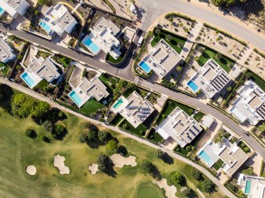 Aerial photo drone point of view golf club with modern villas and apartments on Costa Blanca, Alicante. Sport and recreation tourism concept. Spain clipart