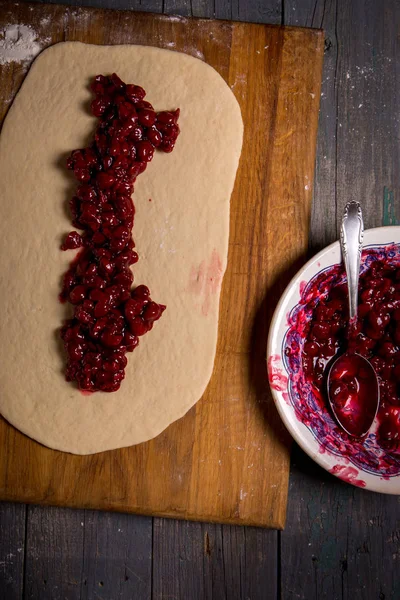 Dough with cherry filling — Stock Photo, Image