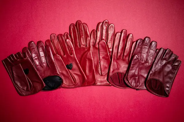 Burgundy and red gloves — Stock Photo, Image