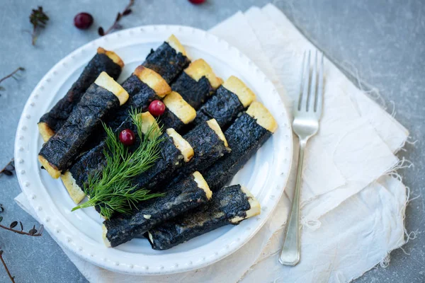 Tofu, nori with cranberries on a plate — Stock Photo, Image