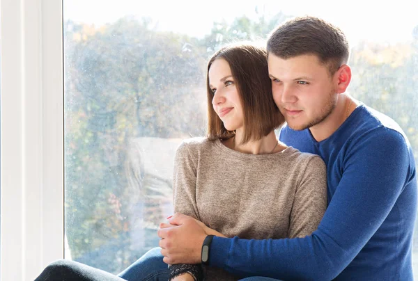 Young Couple Sitting Window Sill Sunny Day — Stock Photo, Image