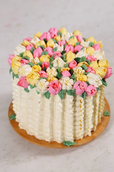 Gorgeous cake with spring decor. Basket of tulips for Valentine\'s Day and Mother\'s Day