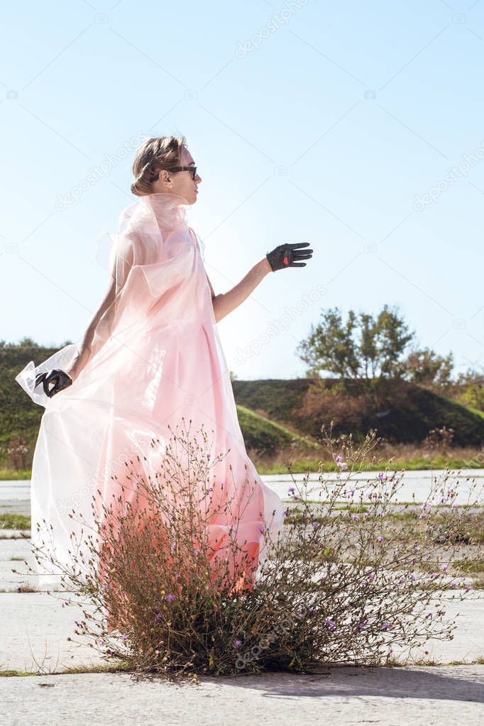 Woman in short, black gloves with white pearls