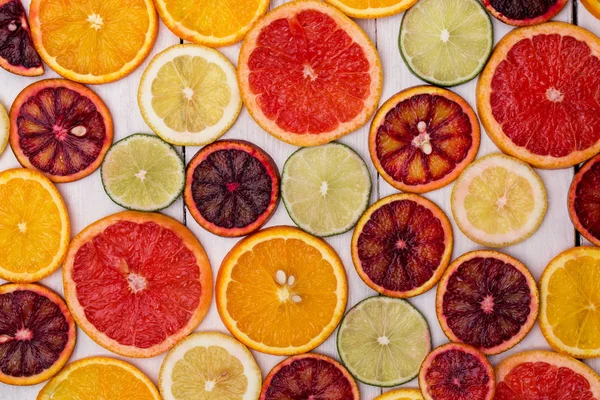 beautiful fresh sliced mixed citrus fruits like background, concept of healthy eating, dieting, top view