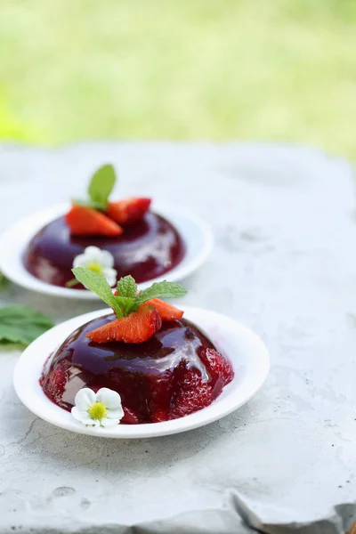 Homemade ground dessert, strawberry jelly with mint