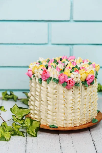 Gorgeous cake with spring decor. Basket of tulips for Valentine\'s Day and Mother\'s Day
