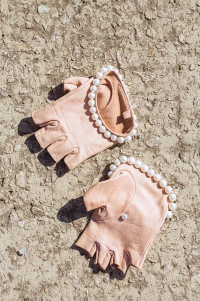 Beautiful, stylish, pink, leather gloves with pearls