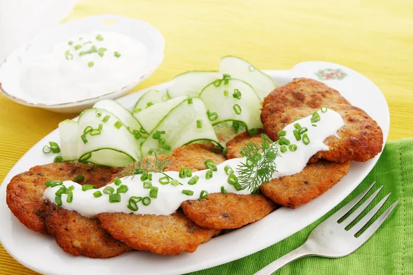 Pancakes from caviar carp with sour cream and cucumber — Stock Image Pancakes Caviar Carp Sour Cream Cucumber Royalty Free Stock Photos