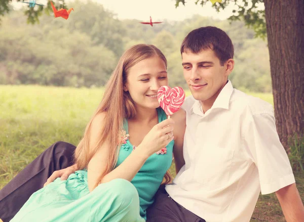 Young Couple Looking Big Candy — Stock Photo, Image