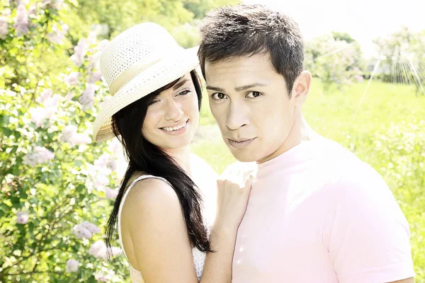 Young Couple Embrace Lilacs — Stock Photo, Image