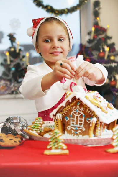 Girl Decorates Gingerbread House Icing Tube — Stock Photo, Image