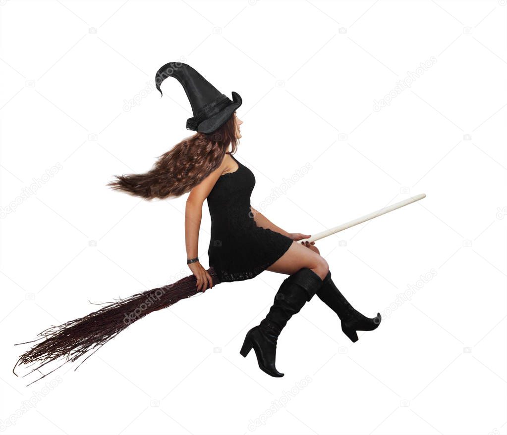 Beautiful long-haired witch flying on a broomstick