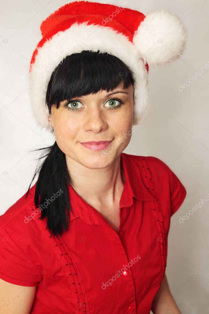 Beautiful benevolent woman in the cap Santa
