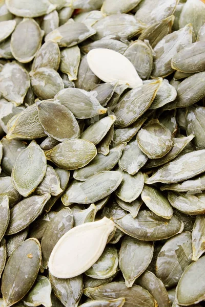 Pumpkin seeds, sort without peel, background