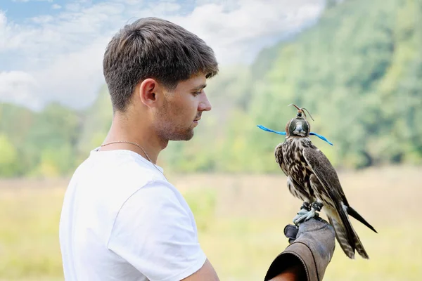 Young Handsome Man Holding Falcon His Arm — Stock Photo, Image