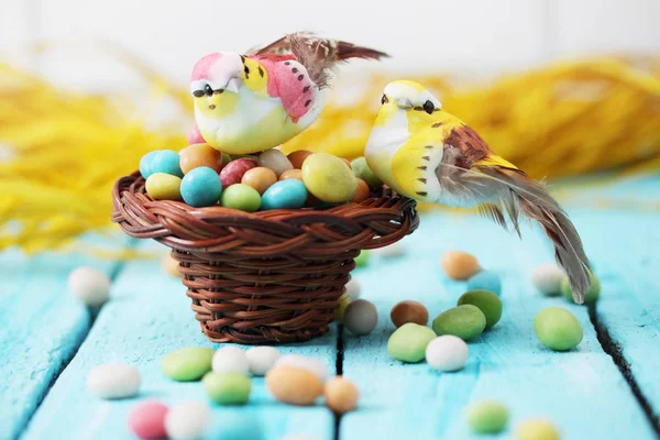 Bird Sitting Small Basket Pile Candies — Stock Photo, Image