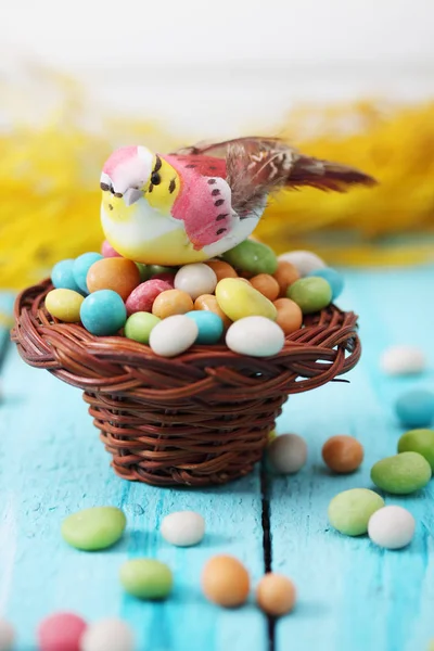 Bird Sitting Small Basket Pile Candies — Stock Photo, Image