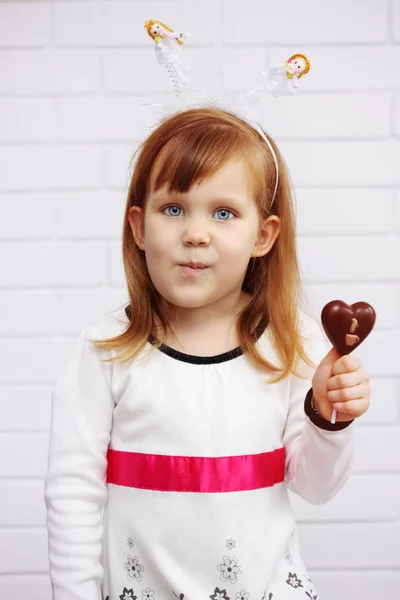 Beautiful Girl Holding Chocolate Heart Stick — Stock Photo, Image