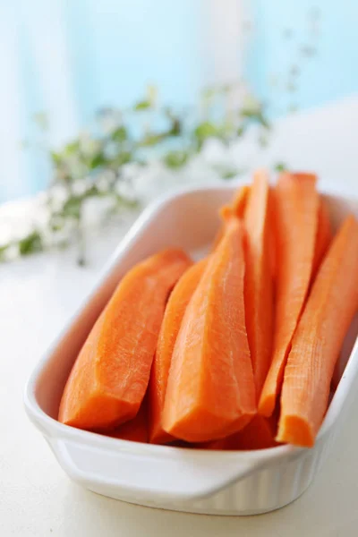 fresh vitamin carrot cut into pieces in a dish