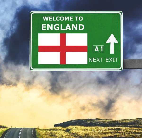 England road sign against clear blue sky