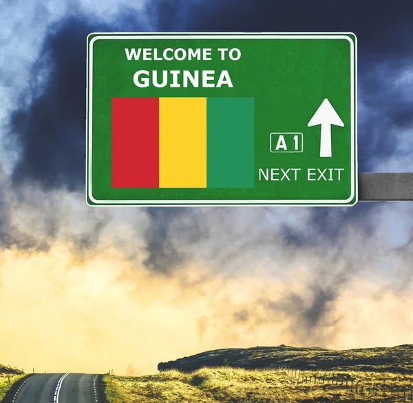 Guinea road sign against clear blue sky