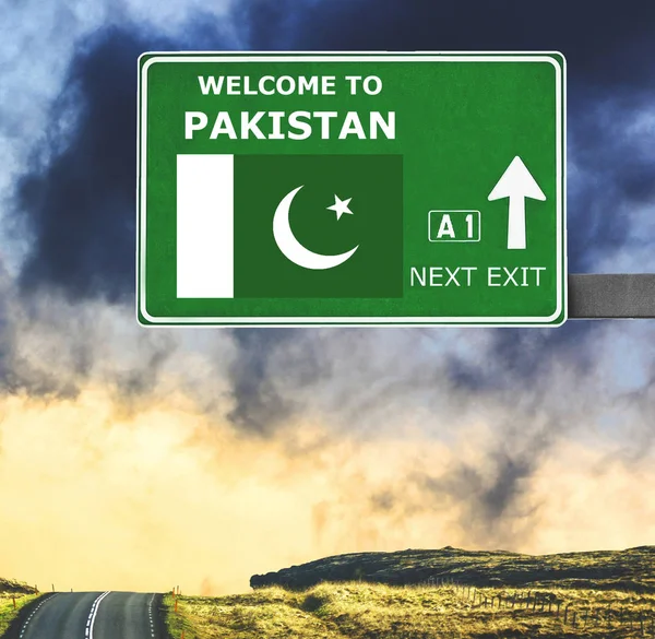 Pakistan road sign against clear blue sky