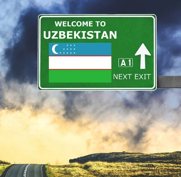 Uzbekistan road sign against clear blue sky