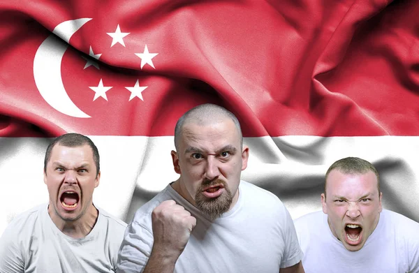 Conceptueel beeld van boze mannen uit Singapore Stockafbeelding