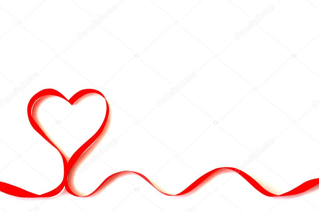 Isolated bright red satin ribbon in the shape of a heart on a white background with copy space. The concept of love, holiday, Valentine Day, care, health, life