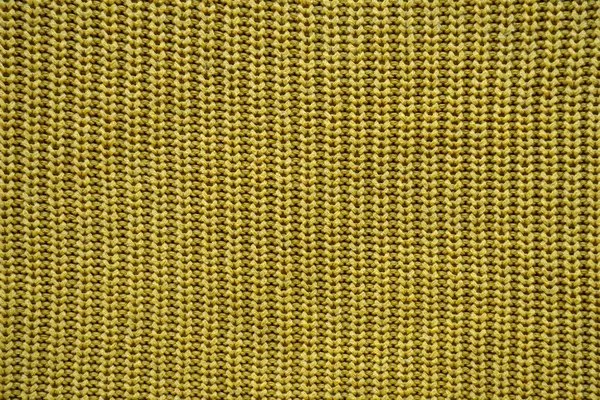 Yellow texture of a knitted English elastic pattern