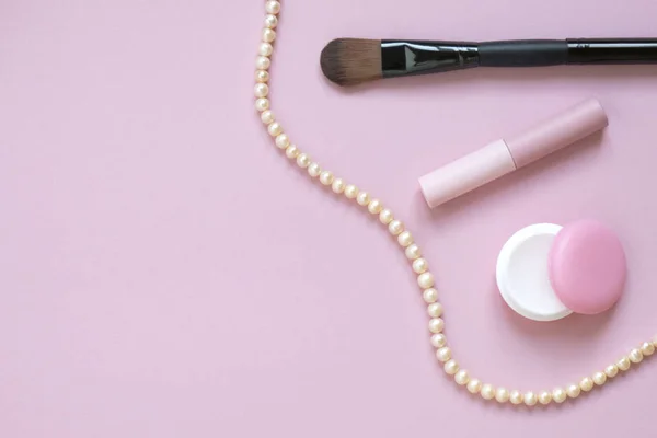 Beautiful flat lay of cosmetics and women's accessories on pink — Stock Photo, Image