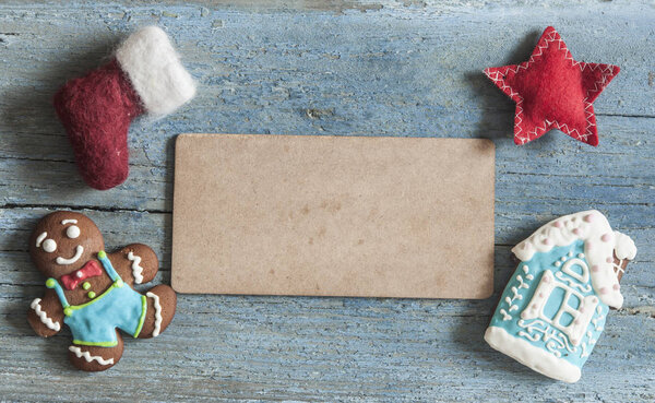 Blackboard with santa claus boot and christmas decoration on wood rustic background with copy space for text