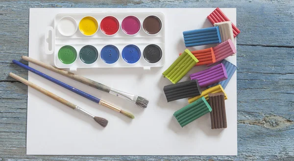 Set Watercolor Paints Brushes Painting Colorful Plasticine Blank White Paper — Stock Photo, Image