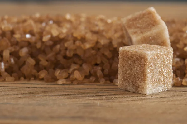 brown sugar cubes on powdered sugar
