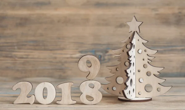 Christmas greeting card. Christmas decoration with text 2019 on wooden background