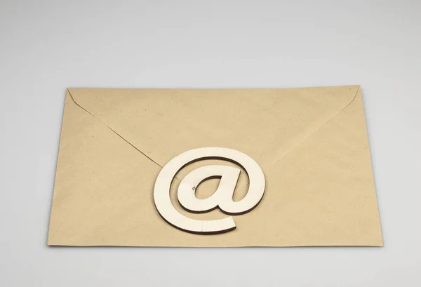 sign e-mail, paper letters on a white background. Internet, correspondence.