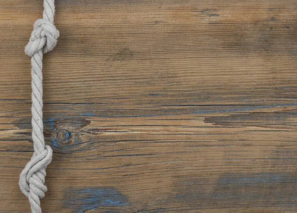 Close up of wooden panels with knot rope — Stock Photo, Image