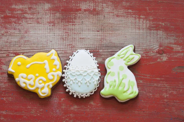 Colorful easter cookies on wooden background — Stock Photo, Image