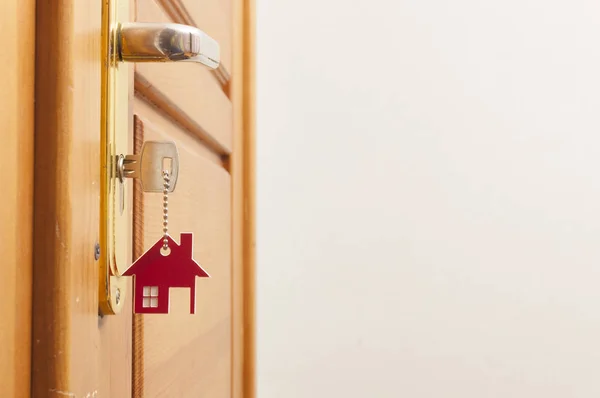 A key in a lock with house icon on it — Stock Photo, Image