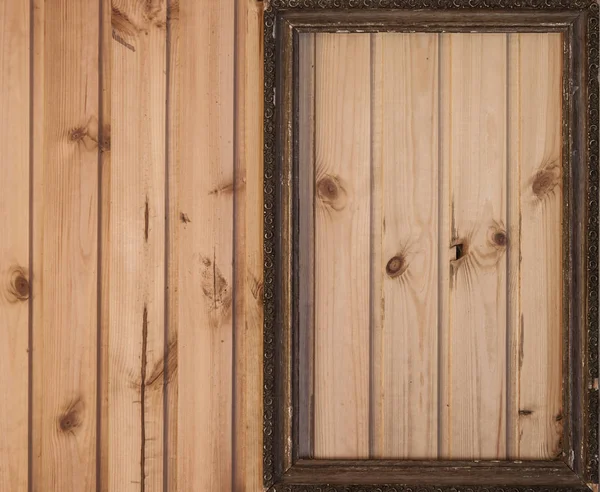 Vintage photo frame on old wooden wall — Stock Photo, Image