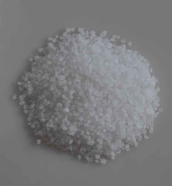 Scattered sea salt on white background — Stock Photo, Image