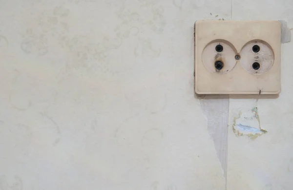 Old white electric socket on wall. — Stock Photo, Image