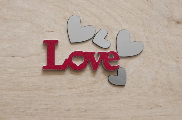 Znamení lásky na dřevěné pozadí — Stock fotografie